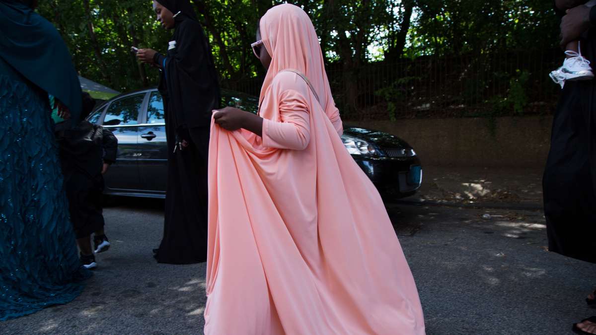 A young girl walks in front of Philadelphia Masjid