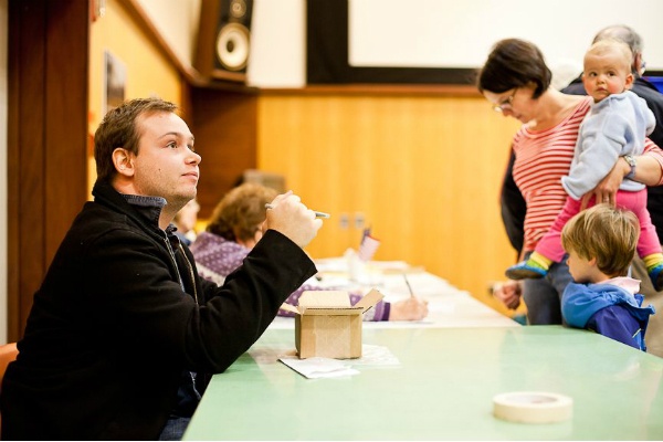 <p><p><span style="font-size: 12pt; line-height: 115%; font-family: 'Helvetica','sans-serif';">Brahm Schultz works the poll clerk table at the Chestnut Hill library Tuesday afternoon. (Brad Larrison/ for NewsWorks)</span></p></p>

