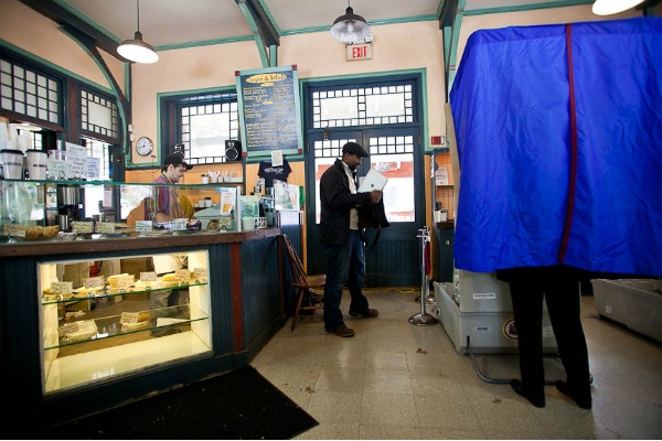 <p><p><span style="font-size: 12pt; line-height: 115%; font-family: 'Helvetica','sans-serif';">Voters and customers at the Hight Point Cafe at Allen's Lane Train Station Tuesday. The Cafe was still open for business and was used as a polling place. (Brad Larrison/ for NewsWorks)</span></p></p>
