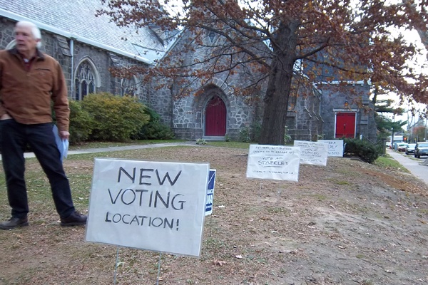 <p>Community activist Luke Russell directs voters to two new polling locations in Germantown and offers rides in his pickup. The former polling location was moved for this election because of a of a handicapped access ramp that didn't meet federal requirements.  (Dave Davies/WHYY)</p>
