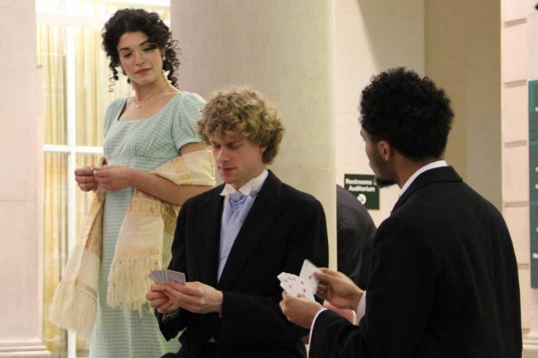 <p><p>Elizabeth Bennet, portrayed by Julia Wise, interrupts a card game between Mr. Bingley (Frederick Brown) and Mr. Darcy (Isaiah Price). (Emma Lee/for NewsWorks)</p></p>
