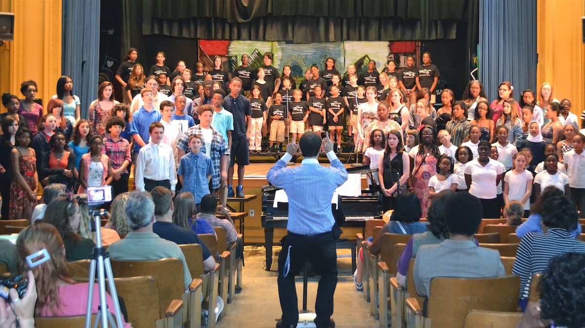  Nick D’Orsaneo directs all the choirs for the grand finale of the Roxborough Regional Choral Music Festival. (Joel B. Frady for NewsWorks) 