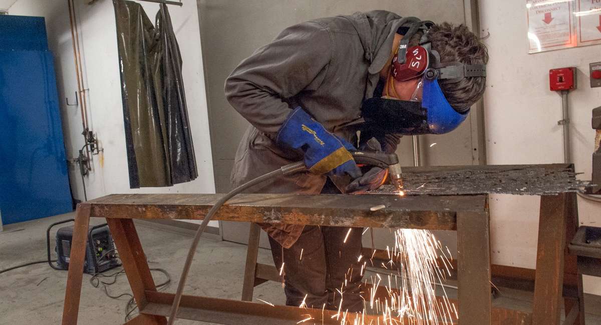 With hours left before the deadline, Erik Fuller completes a final sculpture.