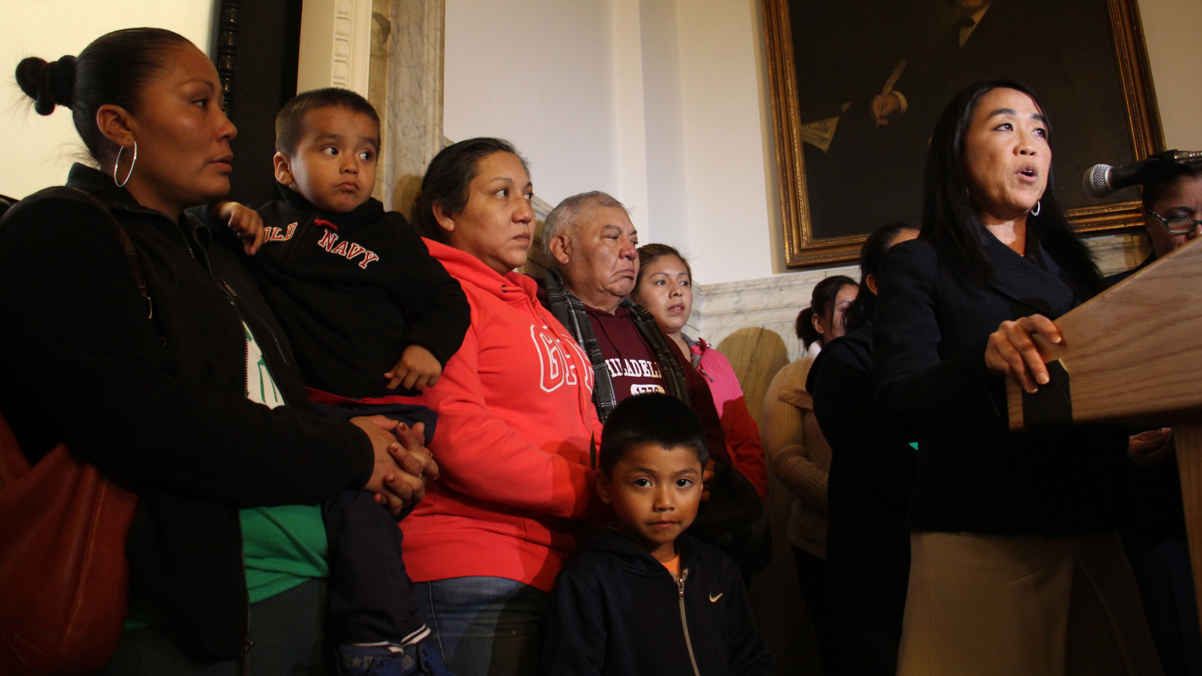 Philadelphia Councilwoman Helen Gym (right) announces an urgent action appeal to the United Nations to end family detention at Berks and two other immigrant detention centers in the U.S. (Emma Lee/WHYY)