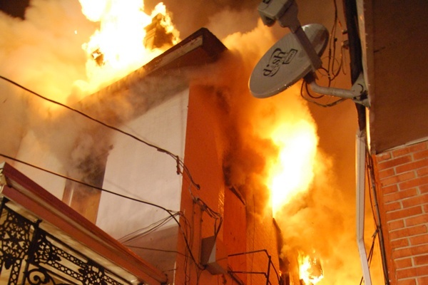 <p><p>Fire investigators found a body buried the beneath the rubble after extinguishing this fire on W. 5th Street in Wilmington. (John Jankowski/for NewsWorks)</p></p>
