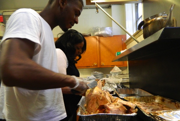 <p><p>Volunteers working in the kitchen. (Kiera Smalls/for NewsWorks)</p></p>
