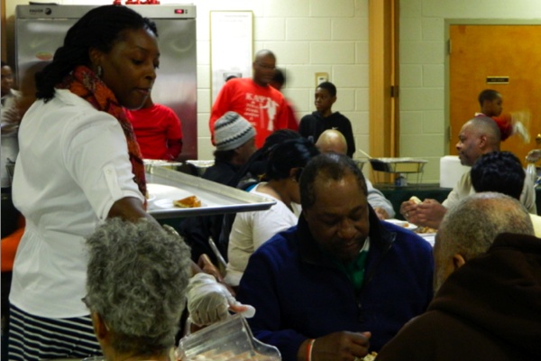 <p><p>Charisma Pressley, who ran for state representative earlier this year, lent a helping hand. (Kiera Smalls/for NewsWorks)</p></p>
