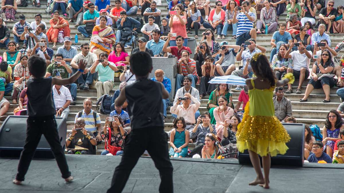 Parents take images and videos of their children perfoming during the Festival of India at Penn’s Landing Saturday, August 12, 2017. (Emily Cohen for NewsWorks)