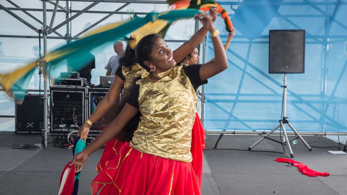 Dancers perform on stage during the Festival of India at Penn's Landing Saturday, Aug. 12, 2017. (Emily Cohen for NewsWorks)