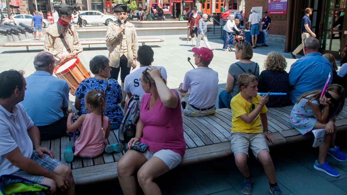 Matthew Skic, assistant curator of the fife and drum party, gives a brief history lesson on the use of music during the Revolutionary War. (Brad Larrison for NewsWorks)