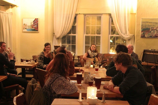 <p><p><span style="font-size: 11pt; font-family: 'Calibri','sans-serif';"> Earth Bread + Brewery diners eat while watching an acoustic performance by Katie Gould, Rosa Diaz on violin and Jerry Allender on pocket trumpet. (Corinne Warnshuis/for NewsWorks). <br /></span></p>
<p><span style="font-size: 11pt; font-family: 'Calibri','sans-serif';"> </span></p></p>
