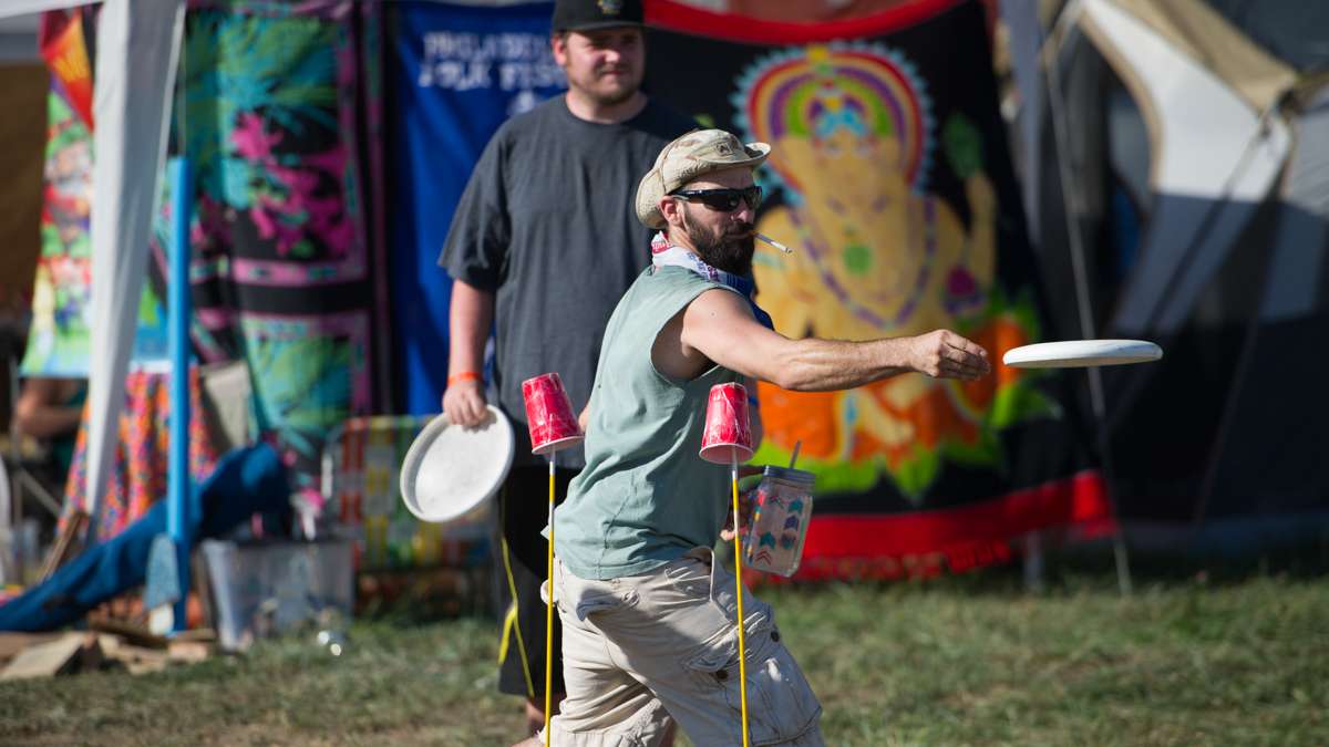 Using a Frisbee, Zack Marshall and his fellow campers play a game of sticks.