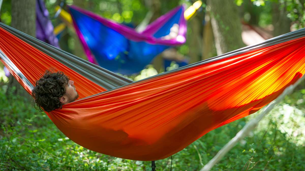 Max Luber relaxes in a hammock in Dulcimer Grove.