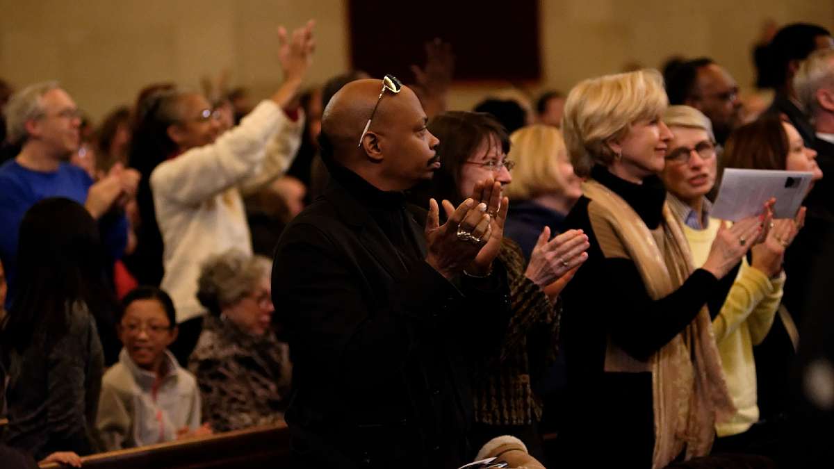 A standing ovation follows the debut performance of violinist Adé Williams at the Martin Luther King tribute concert. (Bastiaan Slabbers/for NewsWorks)