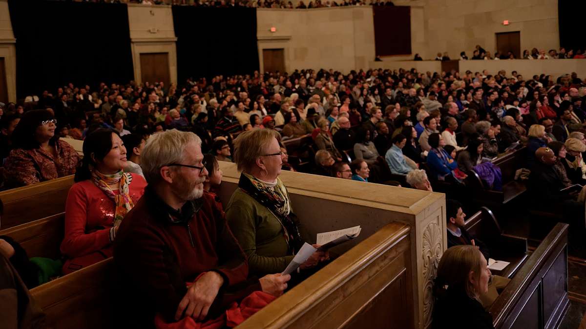 Jim Sharp and Tina Devine of Glenside watch the Philadelphia Orchestra Perform at the free Martin Luther King Day tribute concert. (Bastiaan Slabbers/for NewsWorks)