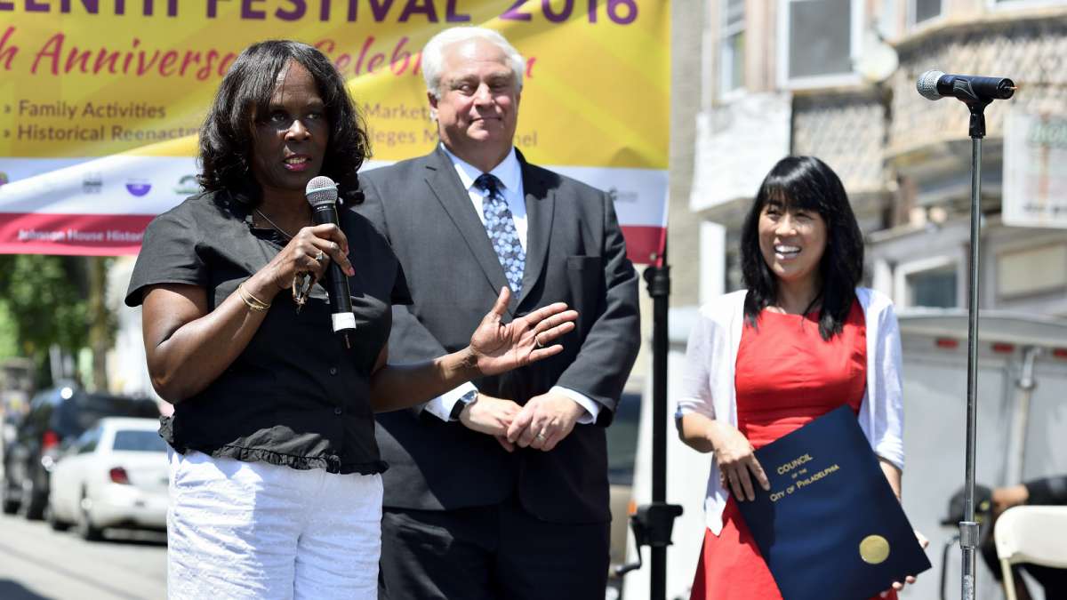 Cornelia Swinson with Johnson House Historic Site speaks as City council members Al Taubenberger and Helen Gym stand by to read the citation honoring Johnson House for its annual Juneteenth celebration.