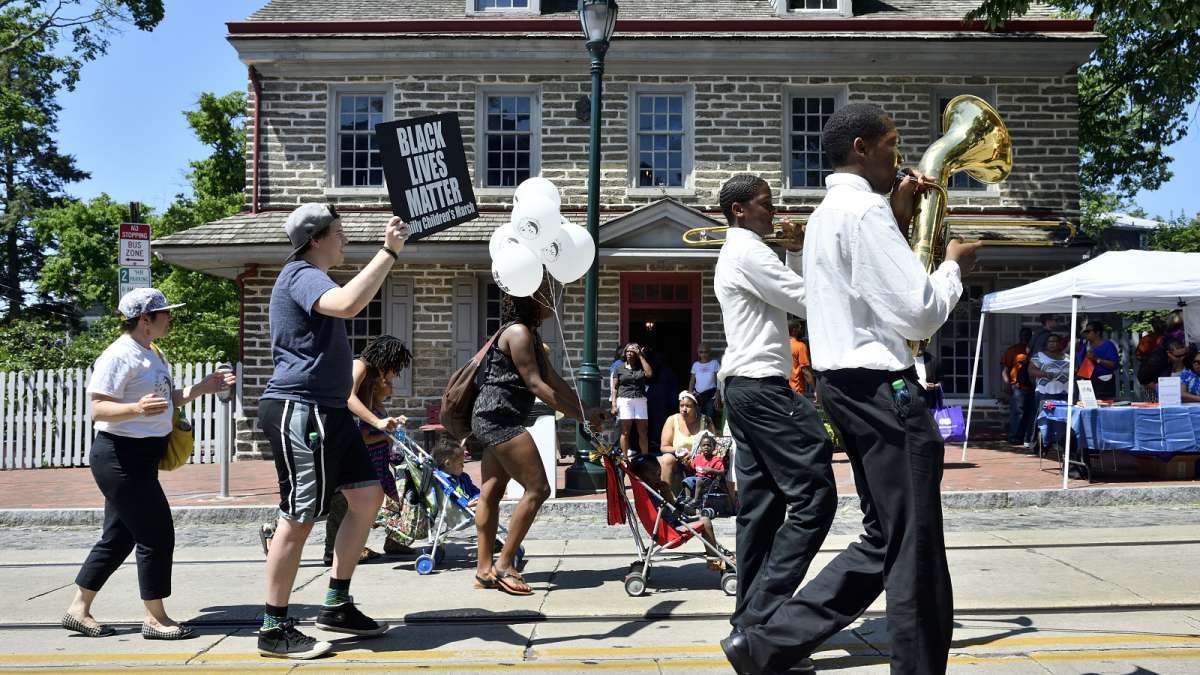 The march arrives at Johnson House Historic Site.