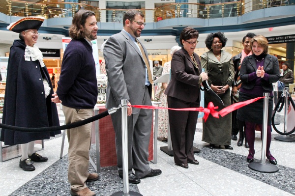 <p><p>Kathy Ott Lovell, Executive Director of the Fairmount Park Conservancy, cuts the ribbon on the Gingerbread House Display at the Rotunda of the Shops at Liberty Place in center city. (Kimberly Paynter/for NewsWorks)</p></p>
