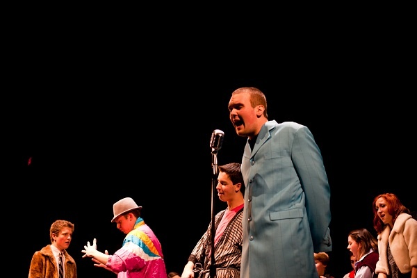 <p>Students from Penn Charter Quaker's Dozen perform Girl Put Your Records on in Costumes at the A Capella Fest at Germantown Friends School. (Brad Larrison/For NewsWorks)</p>
