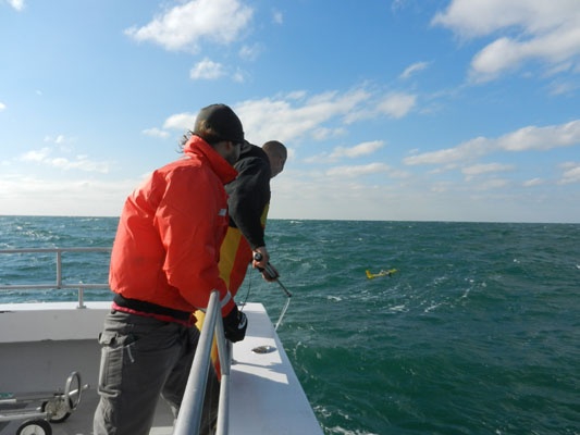 <p><p class="p1">In this series of images, Rutgers oceanography Ph.D. student Travis Miles (orange jacket) leads the retrieval of an underwater glider off the coast of Belmar, N.J. The glider had been transmitting data during Hurricane Sandy on the ocean's role in the superstorm. (Images courtesy Kaycee Coleman/Rutgers)</p></p>

