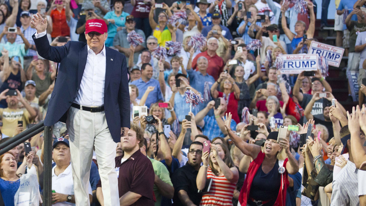  Republican presidential candidate Donald Trump waves to supporters during a campaign rally in Mobile, Ala., on Friday, Aug. 21, 2015. (AP Photo/Brynn Anderson) 