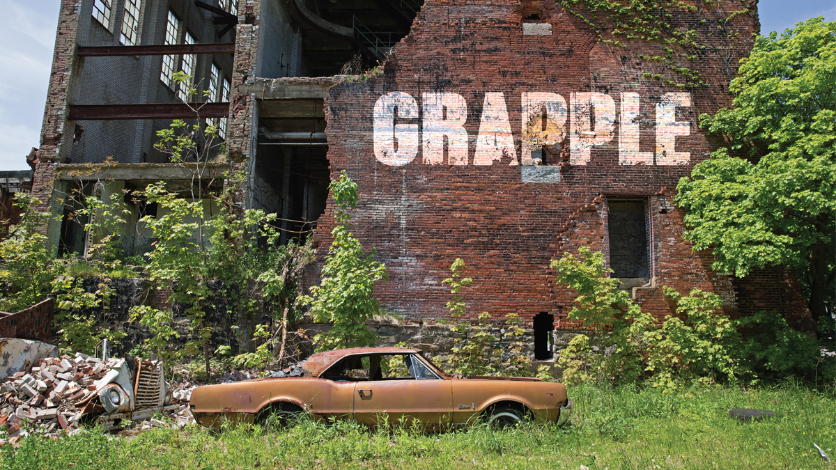  A rusted car outside of the old  