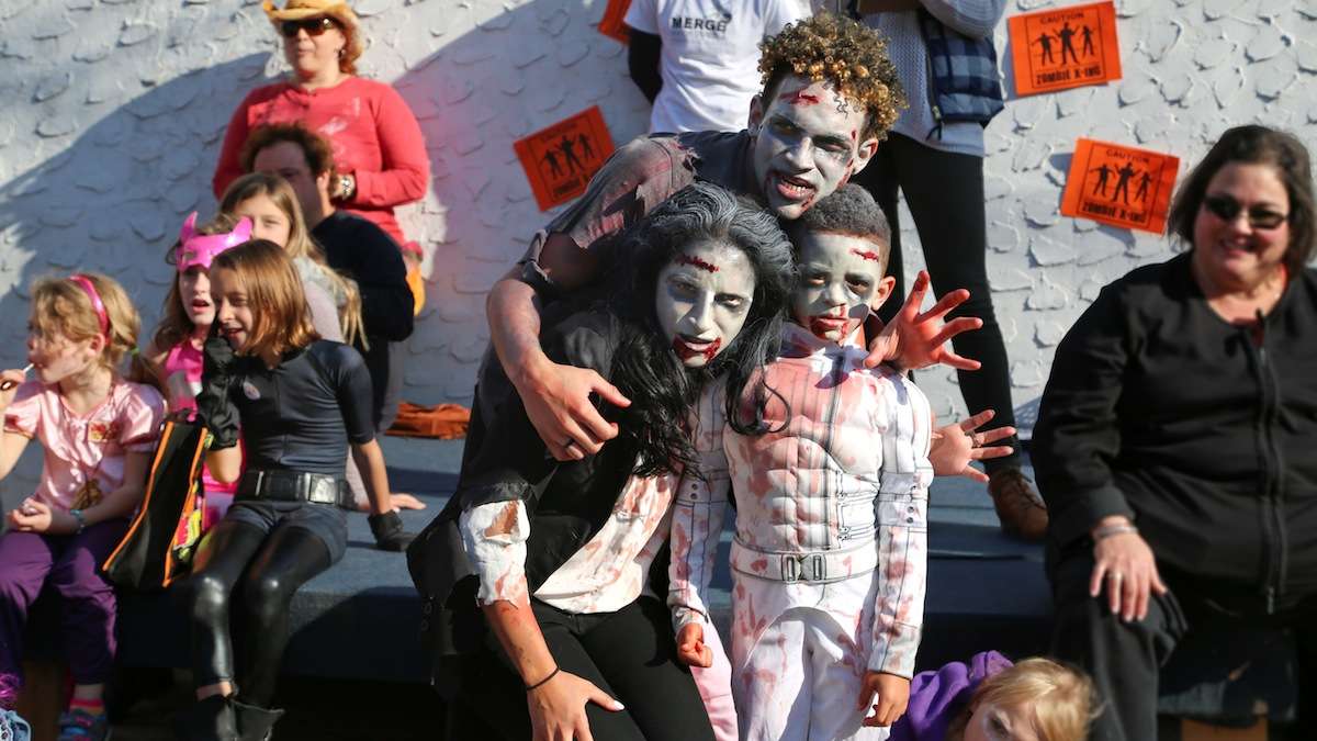 Zombie Thriller Dance Off winners Erik and Erika Coley with their little zombie Ryder. (Natavan Werbock/for NewsWorks)