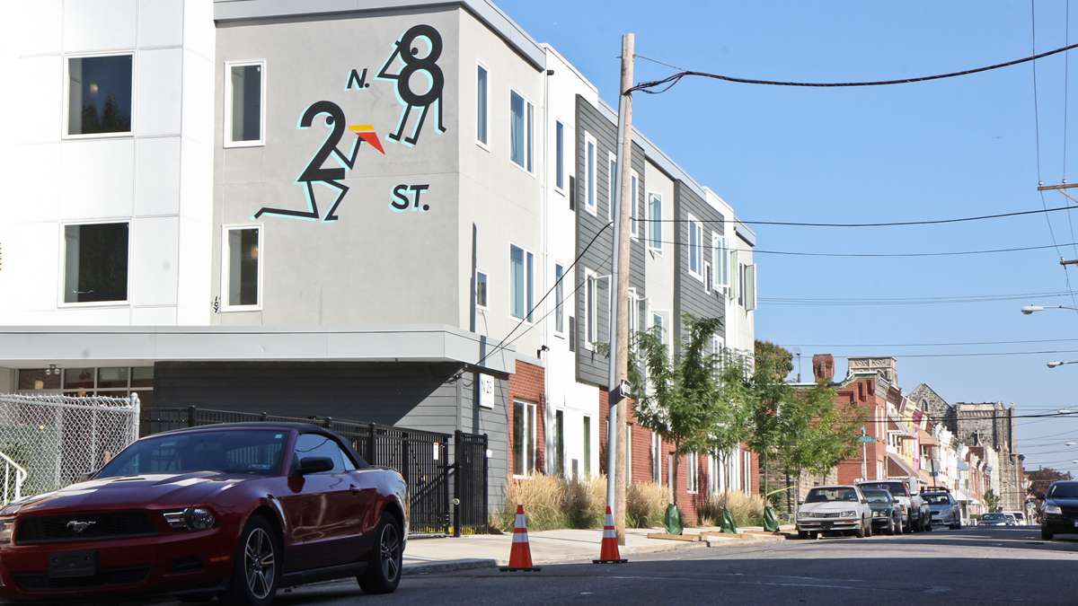 A MMPartners building features a playful hand-painted sign. (Kimberly Paynter/WHYY)