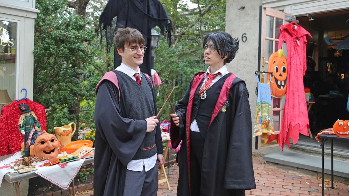 Dan Lemoine as Harry Potter greeting and posing with Harry Potter enthusiasts (Natavan Werbock/for NewsWorks)