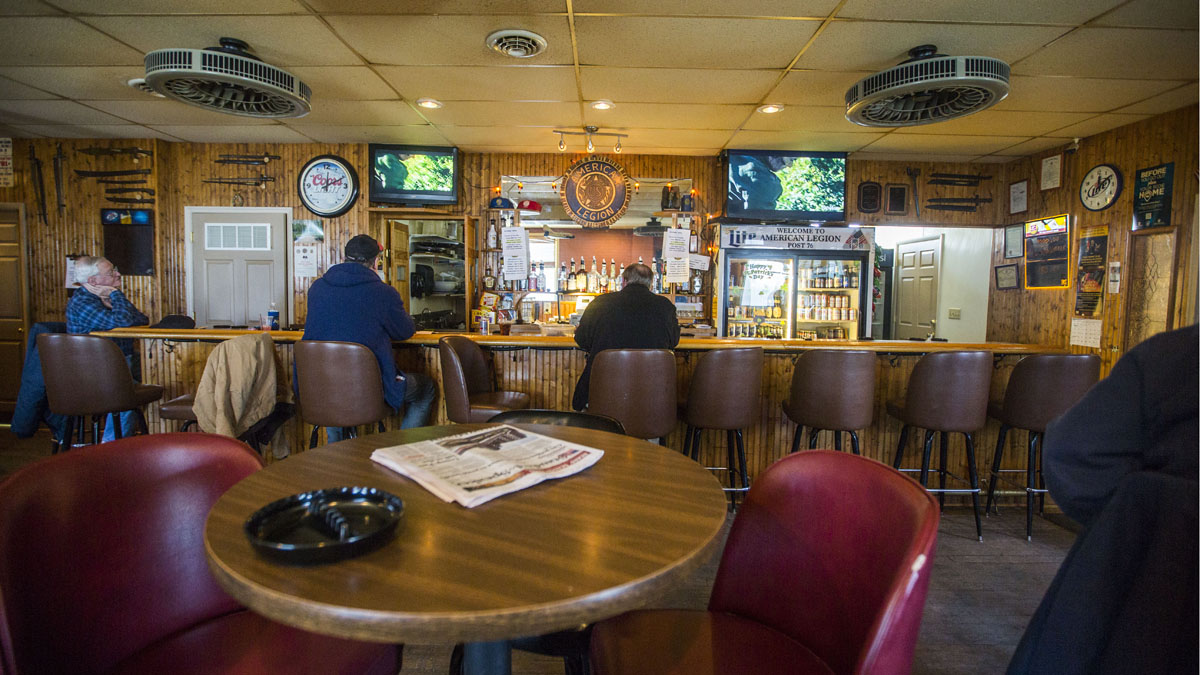  Patrons at the American Legion Bar entrance in Hazleton, Pennsylvania on March 22, 2017. (Jessica Kourkounis/ for Keystone Crossroads) 
