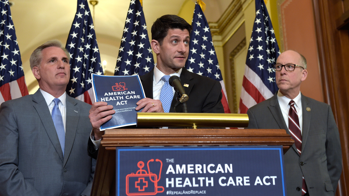  House Speaker Paul Ryan, standing with Energy and Commerce Committee Chairman Greg Walden, right, and House Majority Whip Kevin McCarthy, left, speaks during a news conference on the American Health Care Act on Capitol Hill. (AP Photo/Susan Walsh) 