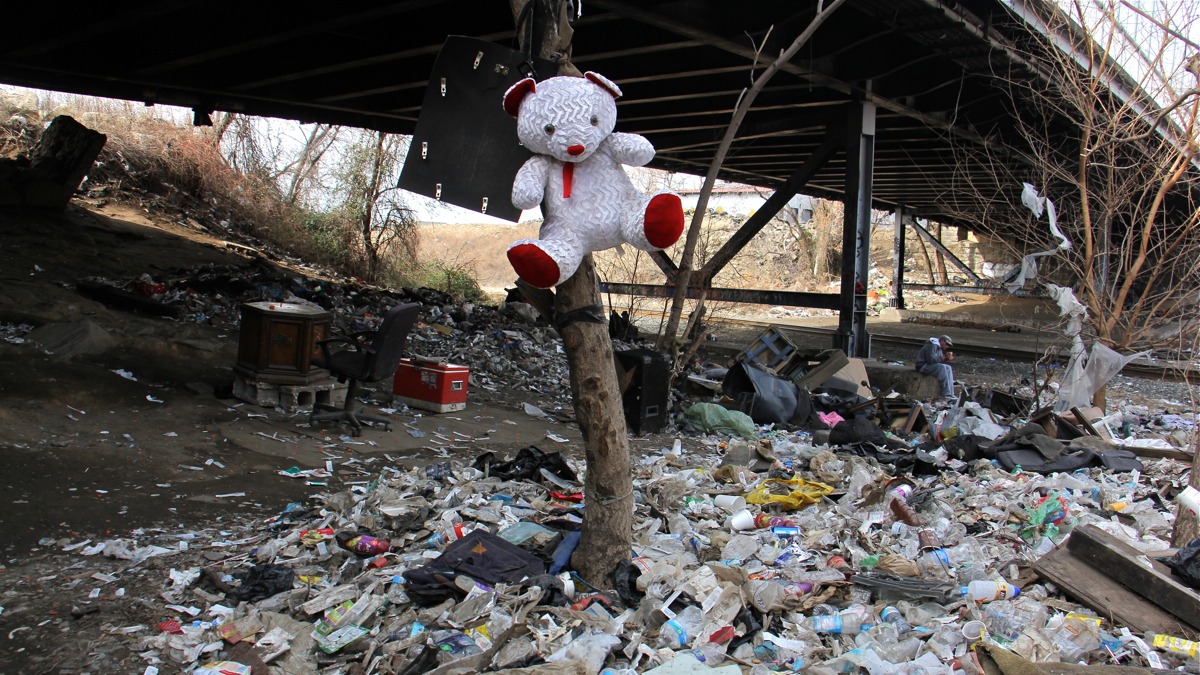  The City of Philadelphia and Conrail will work together to clean and secure the Conrail property in the Fairhill-Kensington neighborhood long used as a campground for drug addicts. (Emma Lee/WHYY) 