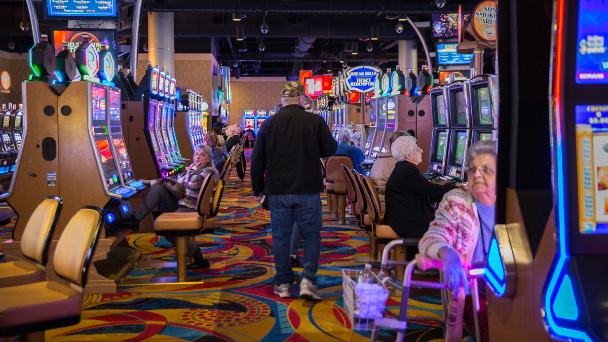  Players try their luck on the slot machines at the Hollywood Casino at Penn National Race Course in Dauphin County, Pennsylvania.  State lawmakers have until the end of May to fix a section of the state’s gaming law that the Pennsylvania Supreme Court ruled unconstitutional.  The part of the law that came into question involves the local share tax.  (Lindsay Lazarski/WHYY)  