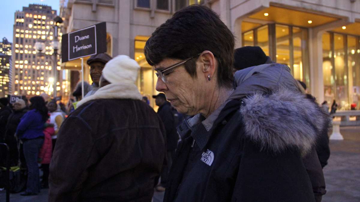 Sister Mary Scullion bows her head as 127 names are read in memory of Philadelphia's homeless who died in 2013. (Emma Lee/for NewsWorks)