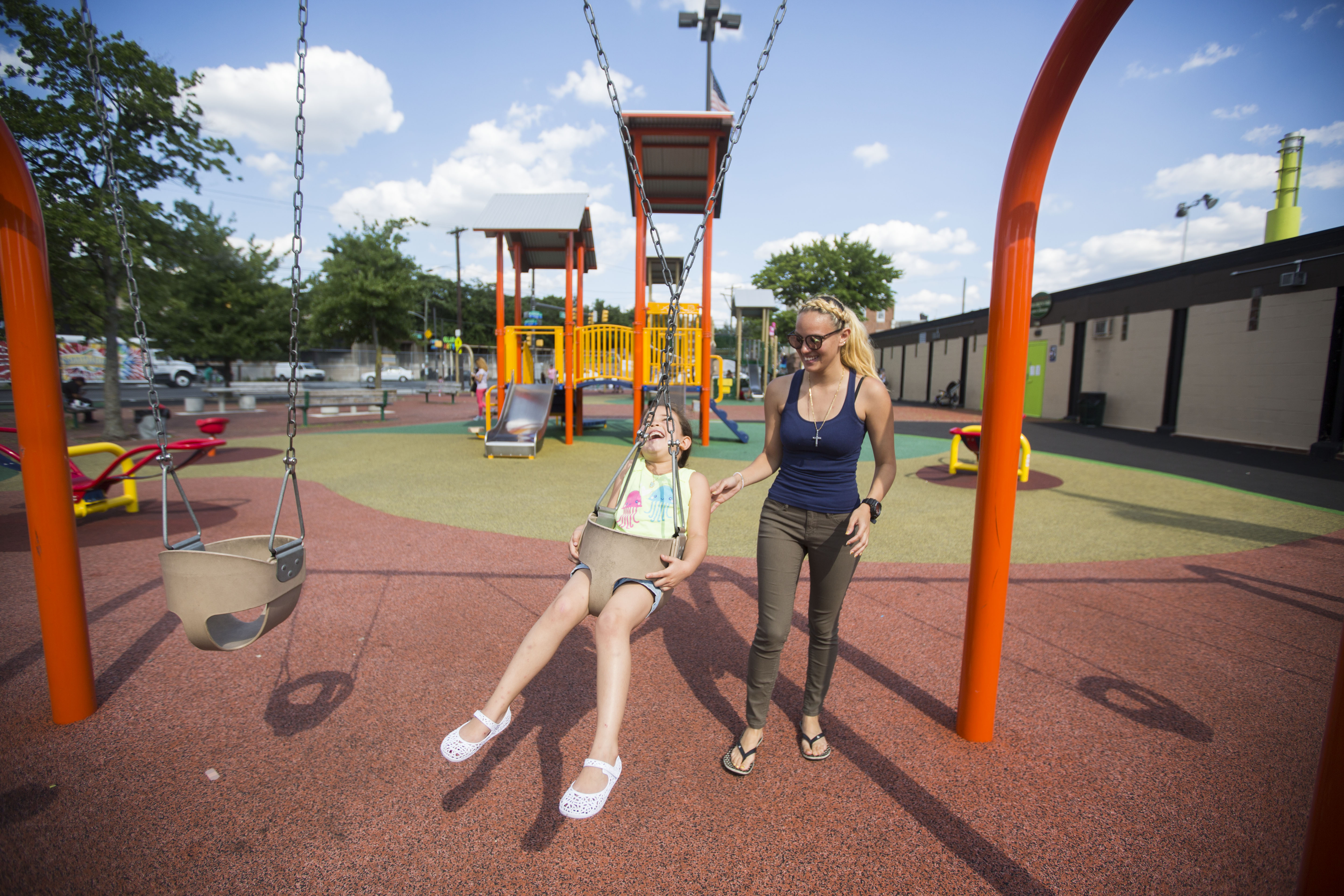 Savannah Zayas and her daughter Layla travel miles from home to find a safe, clean playground. (Jessica Kourkounis/For Keystone Crossroads)