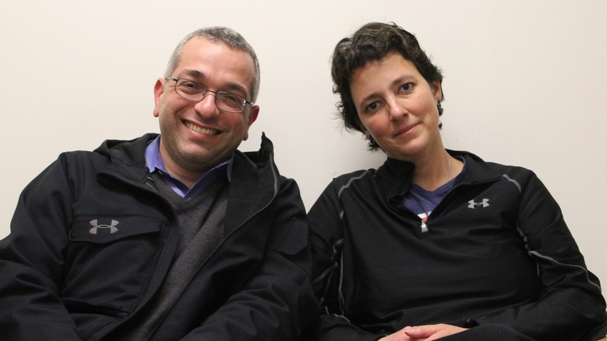  Dr. Hooman Noorchashm, a cardiac surgeon, waits with his wife, Dr. Amy Reed, an anaesthesiologist, wait in her doctor's office at Pennsylvania Hospital. (Emma Lee/WHYY) 