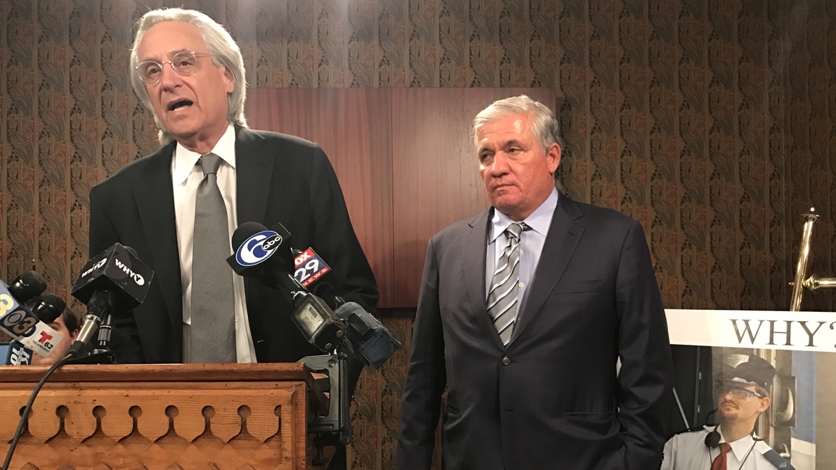  Attorneys Thomas Kline (left) and  Robert Mongeluzzi address reporters at a news conference on Thursday  next to a photo of Amtrak 188 engineer Brandon Bostian. 