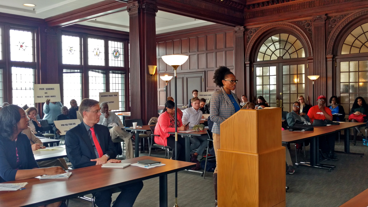  Markita Morris-Louis, senior vice president of community affairs and general counsel at Clarifi, a nonprofit credit counseling agency, testifies against PECO's proposal to pilot a prepaid energy plan during a public hearing in Philadelphia. (Katie Colaneri/WHYY) 