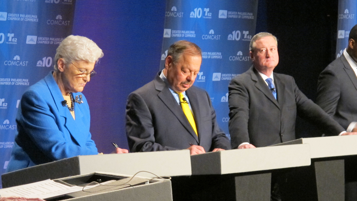  Mayoral candidate Lynne Abraham, flanked by rivals Nelson Diaz and Jim Kenney, takes notes Tuesday night during the debate. She later collapsed on the stage. (Katie Colaneri/WHYY) 