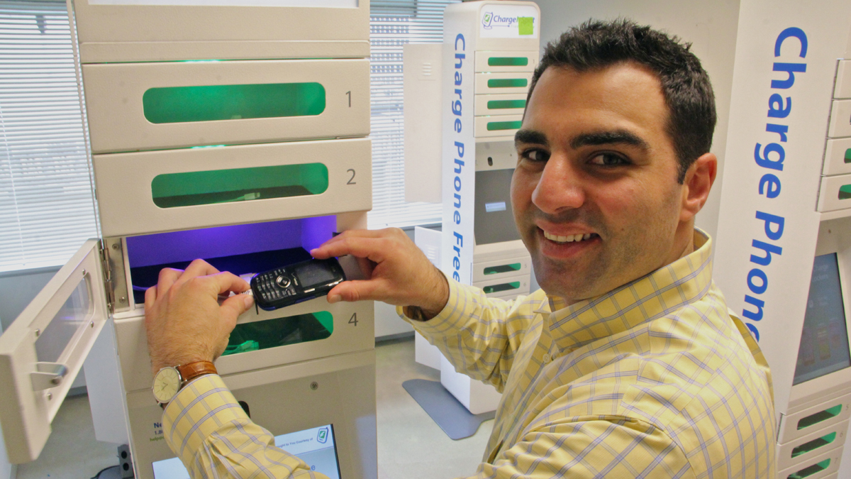  Entrepreneur Doug Baldasare demonstrates the next generation of cell phone charging kiosks. (Emma Lee/for NewsWorks) 