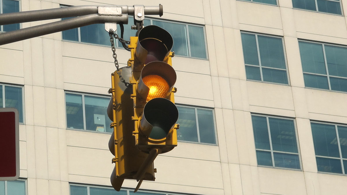  Traffic signal with yellow light on West State Street in Trenton. (Phil Gregory/WHYY) 