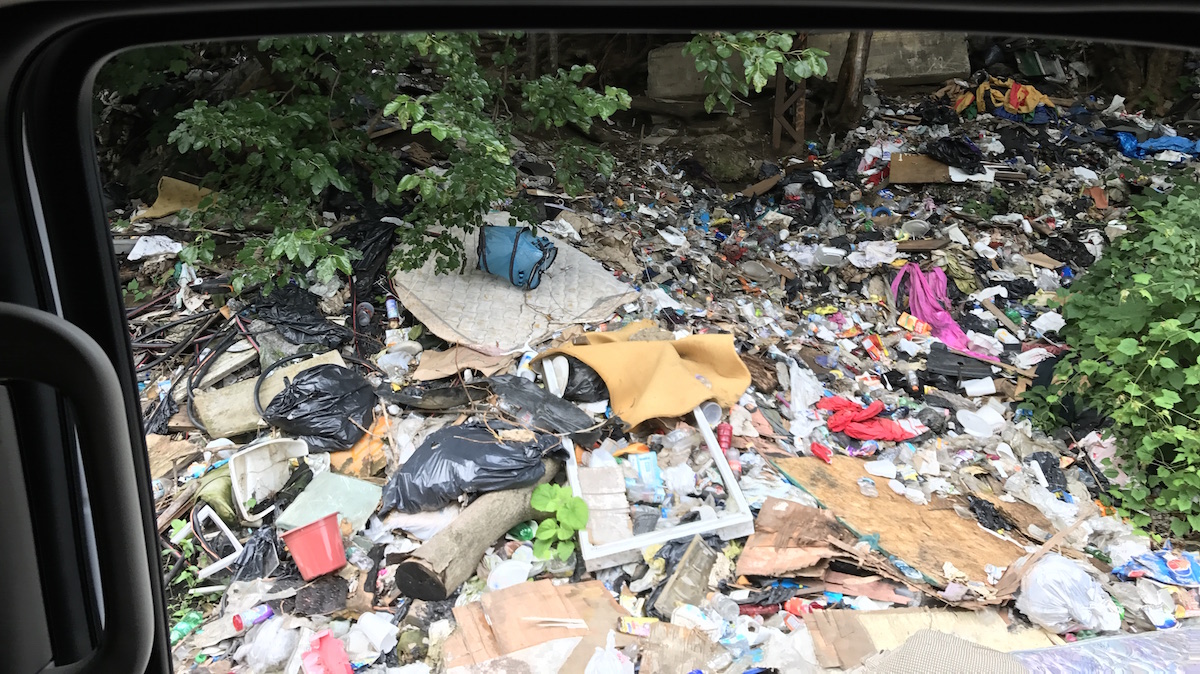  Trash near a heroin encampment is seen from a Conrail vehicle on Thursday. (Joel Wolfram / WHYY) 