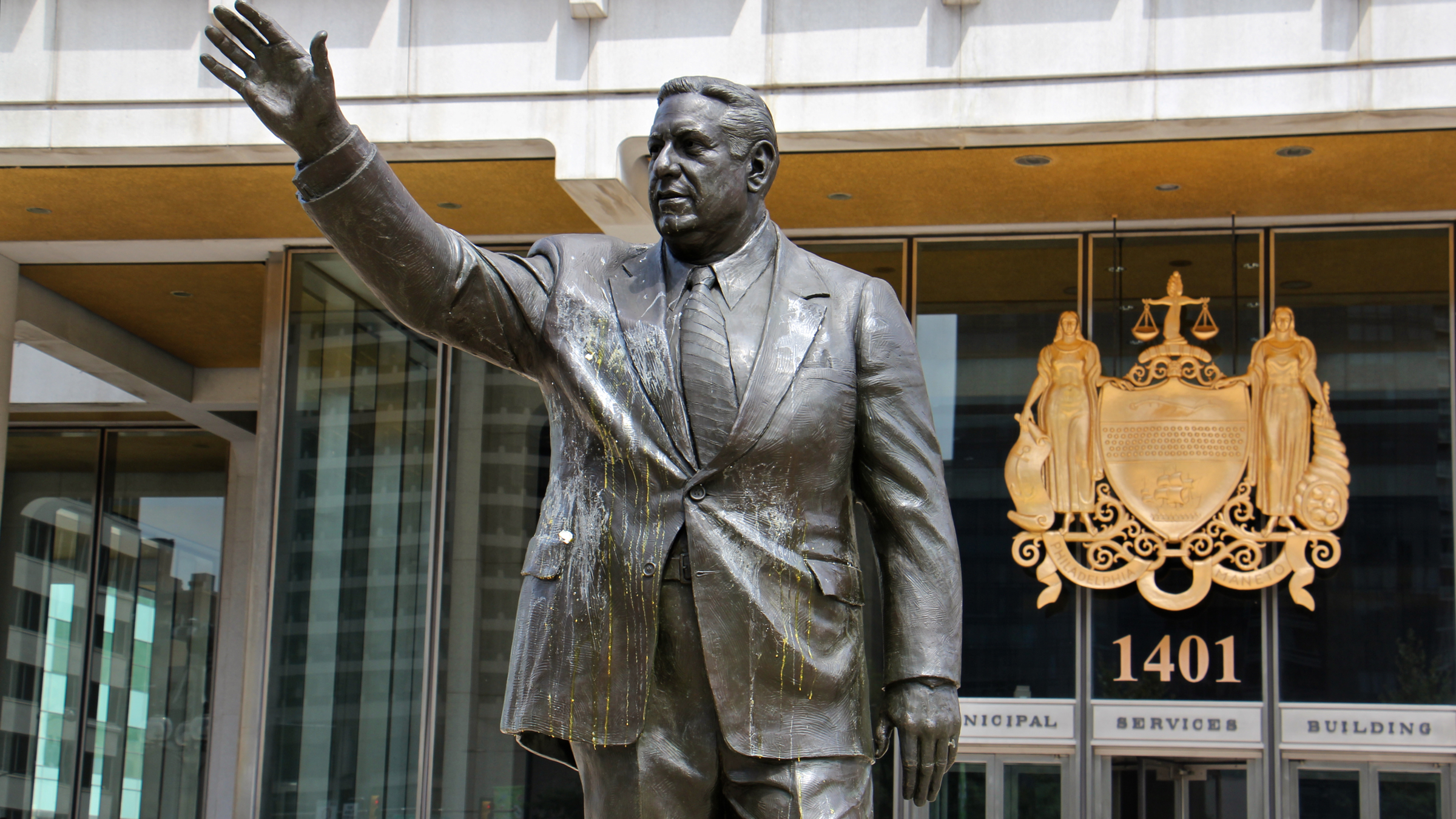 The statue of former Philadelphia Mayor Frank Rizzo drips with egg  in this August 2017 file photo. Last summer, the statue was increasingly the target of vandals and protesters who see it as a symbol of racism. (Emma Lee/WHYY) 