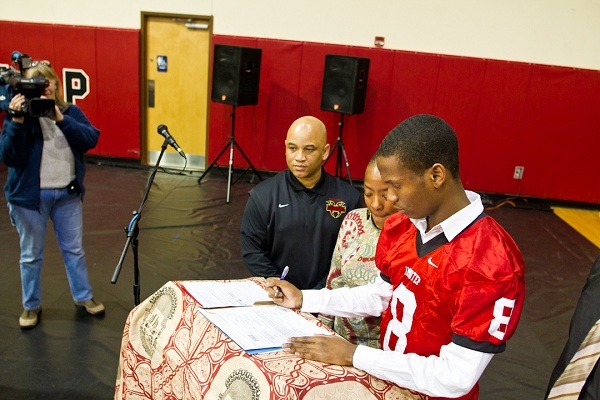 <p><p>Armond Piedra commits to West Chester University as his mother, coach and a television camera look on. (Brad Larrison/for NewsWorks)</p></p>
