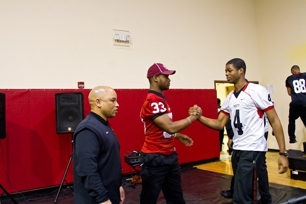 <p><p>Teammates David Williams and Andre Dreuitt, a sophomore quarterback, shake hands after the signing day ceremony. (Brad Larrison/for NewsWorks)</p></p>

