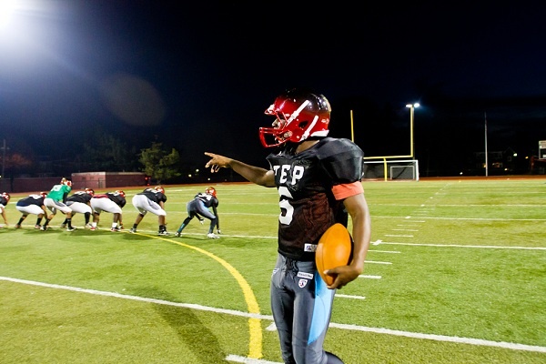<p><p>Eerin Young, one of Imhotep's premier running backs, talks about the play he just ran during Tuesday's practice. (Brad Larrison/for NewsWorks)</p></p>
