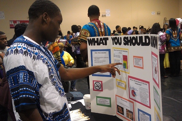 <p><p>Rahmir Johnson then checks his blood pressure on a chart on a display at the East Germantown school's health fair Tuesday. (Yasmein James/for NewsWorks)</p></p>
