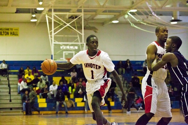 Imhotep's Brandon Austin moves up the court during his team's 51-43 win over Philadelphia Electrical on Saturday. (Brad Larrison/for NewsWorks)
