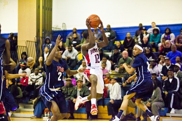 Imhotep's Jakwan Jones leaps to catch to a pass in his teams 51-43 win over Philadelphia Electrical. (Brad Larrison/for NewsWorks)
