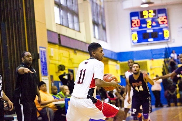 Carnel Harley of Imhotep Charter catches a pass in his team's 51-43 win over Philadelphia Electrical. (Brad Larrison/for NewsWorks)
